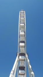 Low angle view of building against clear blue sky