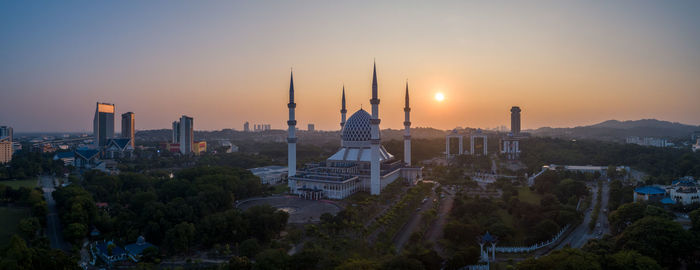 Cityscape against sky during sunset