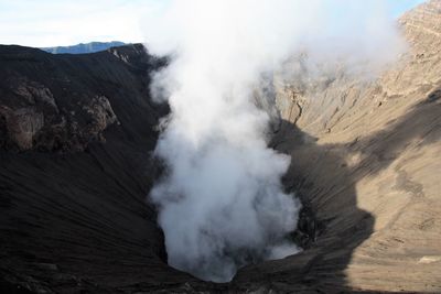 Smoke emitting from volcanic mountain