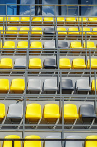 Empty plastic colored seats in stadium without spectators. close-up. water arena.