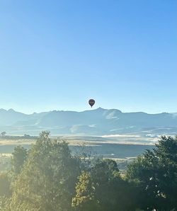 View of hot air balloon against clear blue sky