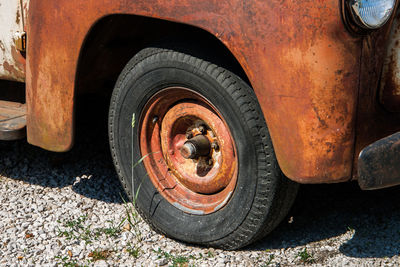 Close-up of rusty car on street