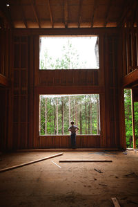 Man standing by window