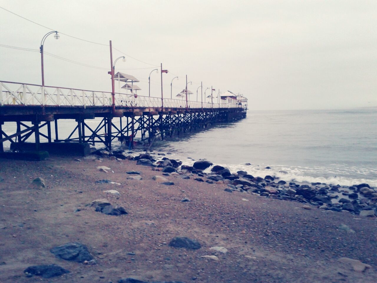 sea, water, horizon over water, beach, shore, sky, tranquil scene, tranquility, wave, nature, scenics, sand, beauty in nature, clear sky, pier, day, outdoors, no people, copy space, idyllic