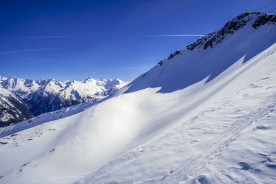 Scenic view of snowcapped mountains against sky