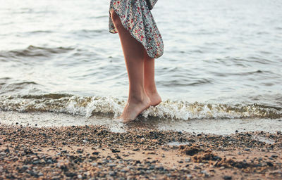 Low section of woman at beach