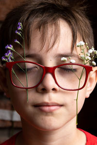 Close-up of young woman wearing eyeglasses