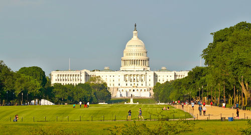 Senate building and crowd walking the national mall in washington dc during summer afternoon