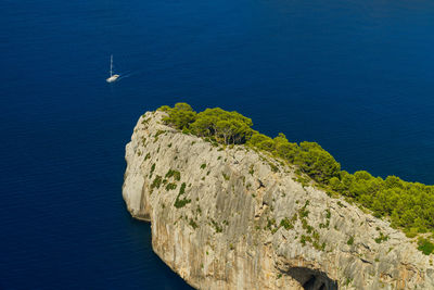 High angle view of rocks by sea