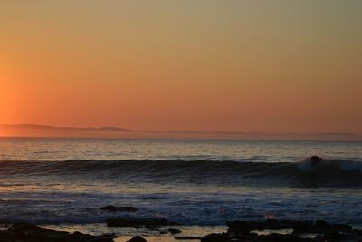 Scenic view of sea at sunset