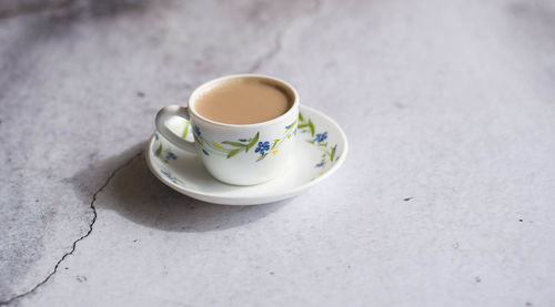 High angle view of coffee cup on table