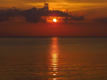 Scenic view of sea against romantic sky at sunset