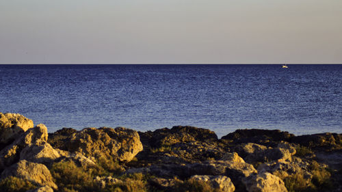 Scenic view of sea against clear sky