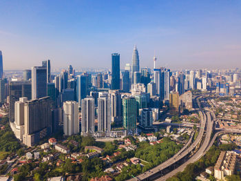 High angle view of buildings in city against sky