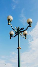 Low angle view of street light against sky