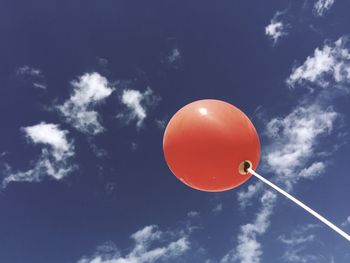 Low angle view of balloons against sky