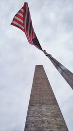 Low angle view of flag against sky