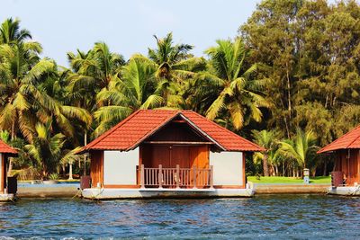 House by swimming pool against sky