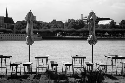 Chairs by rivee rhine against sky