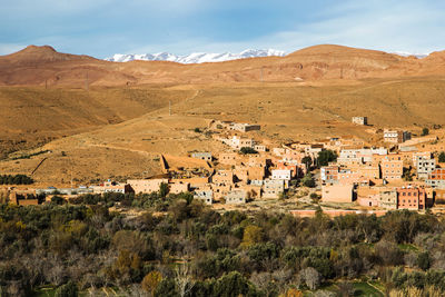 Panoramic view of desert village against sky, morocco 