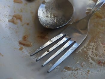 High angle view of fork on table