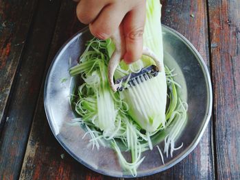 High angle view of person preparing food on table