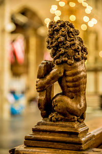 Close-up of angel statue against building