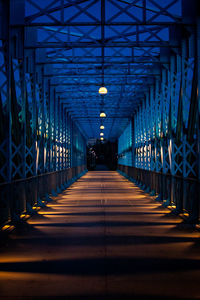 Illuminated footbridge at night