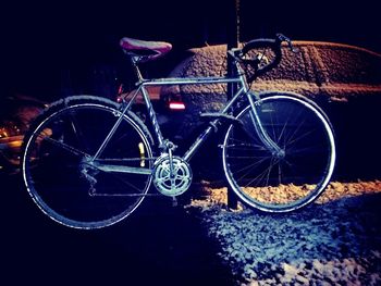 Bicycle wheel against black background