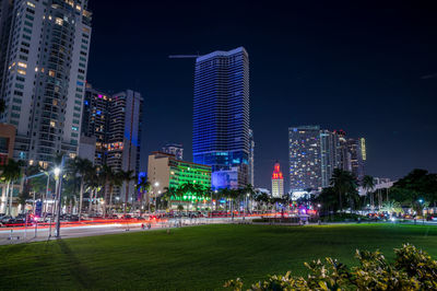 Illuminated buildings in city at night