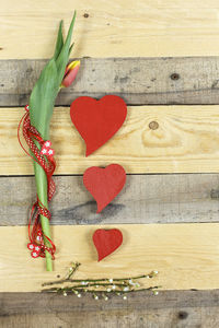 Directly above shot of flower and heart shape decorations on table