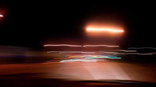 Light trails on road at night