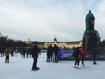 Tourists against clear sky