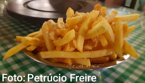 Close-up of burger and fries on plate