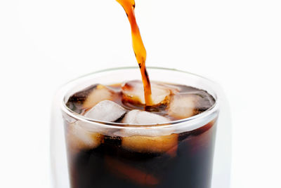 Close-up of drink against white background