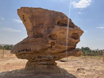 Rock formations on mountain against sky