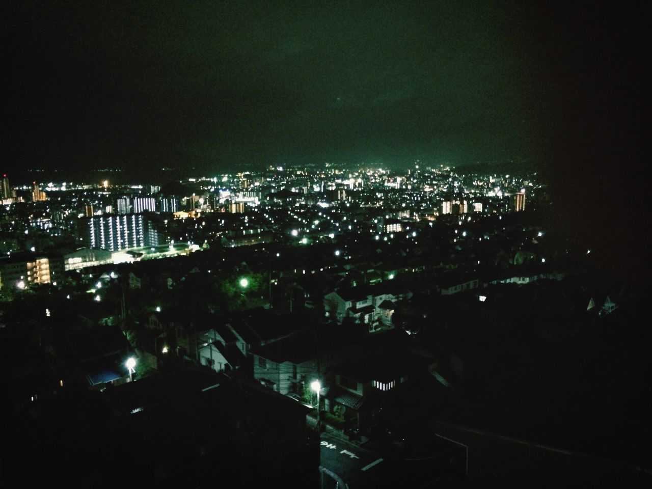 night, illuminated, building exterior, cityscape, city, architecture, built structure, crowded, high angle view, residential district, residential building, residential structure, dark, sky, city life, skyscraper, no people, outdoors, copy space, community