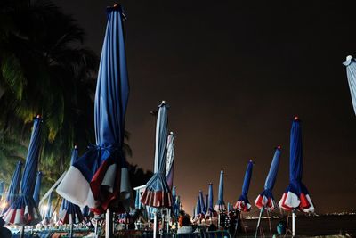 Panoramic view of flags against sky at night