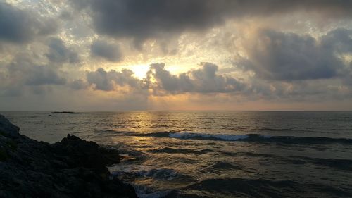 Scenic view of sea against sky during sunset