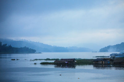 Scenic view of bay against sky