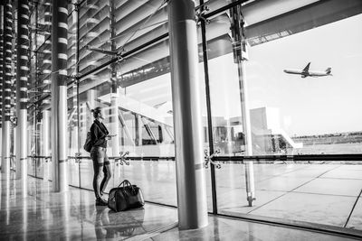 Full length of woman standing at airport