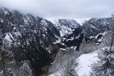 Scenic view of snowcapped mountains against sky