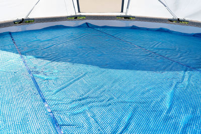 Low angle view of windmill against sky