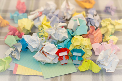 Close-up of multi colored paper on table