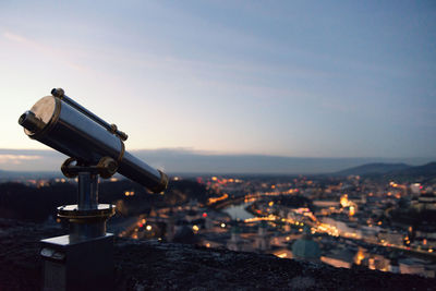 Aerial view of illuminated cityscape against sky