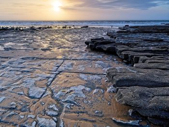 Scenic view of sea against sky during sunset