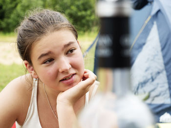 Portrait of a smiling young woman outdoors