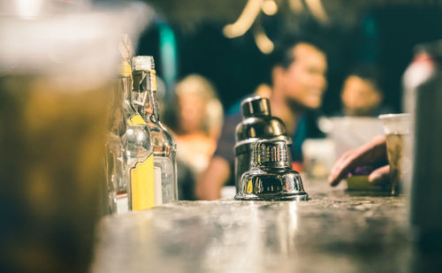 Close-up of wine bottles on table