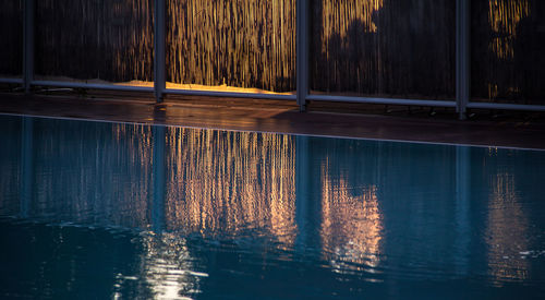 Swimming pool by lake at night