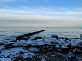 Scenic view of sea against sky during winter